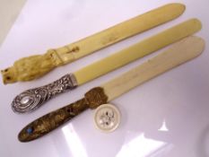 Three ivory page turners together with a small Japanese inlaid ivory pill box