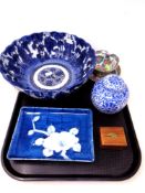 A tray containing Oriental wares to include a blue and white scalloped edge fruit bowl,