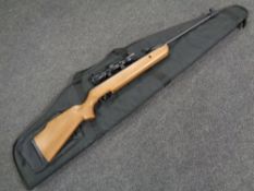 An SMK air rifle with scope in a Buffalo River carry bag, .