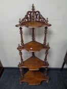 A Victorian walnut four tier corner whatnot stand