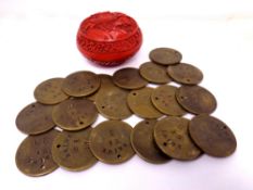 A Chinese cinnabar lacquered lidded pot together with 20 vintage brass transport tokens