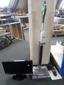 A G-tech 22v Air Ram cordless vacuum together with a Sharp 19 inch LCD TV with remote