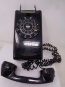 A retro wall mounted telephone