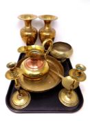 A tray of antique and later brass wares, pair of candlesticks, ladle,