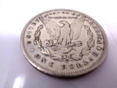 An American 1895 one dollar.