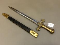 A Victorian brass-hilted bandman's sword in leather sheath