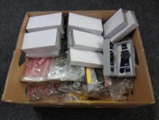 A box containing sixteen Lyfe wristwatches on fabric straps together with a large quantity of