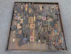 A montage of printers block letters mounted in a frame