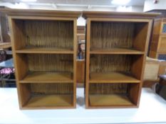 A pair of contemporary open wall shelves