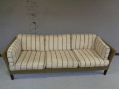 A 20th century Danish Erik Jorgensen Mobelfabrik three seater settee upholstered in a two-tone