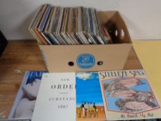 A crate containing a quantity of vinyl LPs and 12