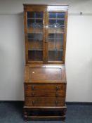 An Edwardian glazed oak bookcase