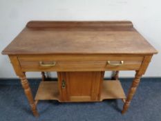 An Edwardian washstand fitted cupboard beneath