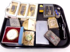 A tray containing miscellany to include Ringtons die cast vehicles, compact cigarette case,