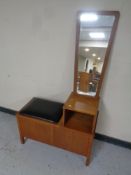 A teak telephone seat together with a teak framed wall mirror