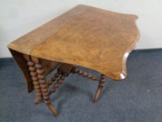 A Victorian walnut Sutherland table