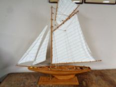 A box containing eighteen leather bound Heron Press Charles Dickens volumes together with a John