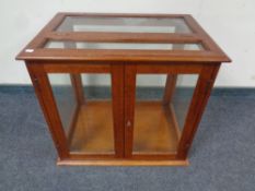 A glazed double door display cabinet