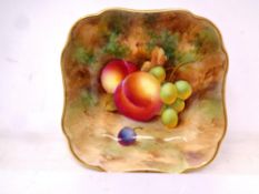 A Royal Worcester gilt-rimmed square dish, with hand painted Peach and Grape decoration,