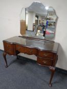 A walnut mirror back dressing table