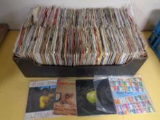 A box containing a large quantity of vinyl 7