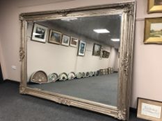 A very impressive silvered floor standing mirror,