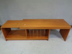 A mid 20th century teak extending entertainment stand.