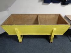 A 19th century pine dough bin on metal casters