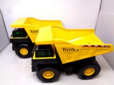 Two Tonka tin plate dump trucks