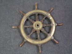 An antique eight-spoke ships wheel