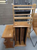 A set of contemporary folding book shelves together with a oak CD stand and magazine rack