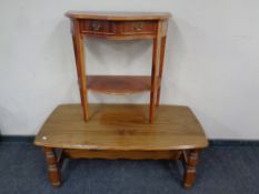 A pine coffee table together with a serpentine fronted two-tier hall table fitted two drawers in a