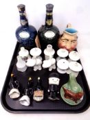 A tray containing a collection of antique and later pipe funnels, Wade ashtray,