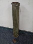 A large brass ammunition shell together with a part-exploded shell