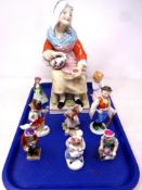 A tray containing large Staffordshire figures of a seated lady together with eight further