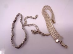 Three silver bracelets.