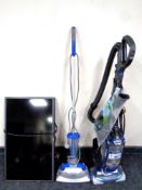 A Shark upright vacuum together with a Home-Tec floor cleaner and an LG 32