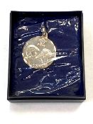 A Silver Charles and Diana pendant.