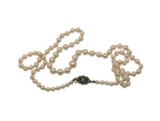 A strap of pearls with marcasite clasp