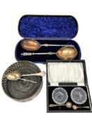 A silver plated wine coaster, pair of cut glass salts, cased pair of plated spoons,