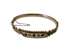 An antique ruby and diamond bangle CONDITION REPORT: 7.