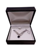 A sapphire and diamond pendant on chain