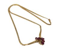 An 18ct gold ruby and diamond necklace, 12.45g. CONDITION REPORT: Chain length 42 cm.