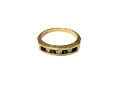 An 18ct gold diamond and sapphire ring, size N, 4.1g.