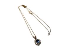 A 9ct gold diamond and sapphire pendant