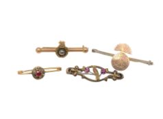 A silver Northumberland Fusiliers bar brooch and three other gold brooches CONDITION