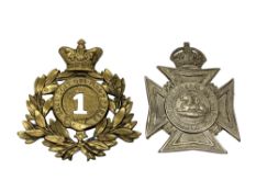 Two Edwardian helmet plates,