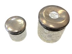 Two cut glass silver topped dressing table jars