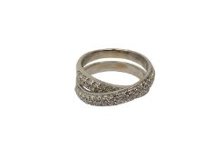 An 18ct white gold diamond cross over ring set with forty two diamonds, size O/P.
