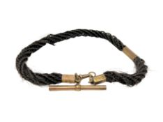 A Victorian hair Albert with yellow metal fittings,